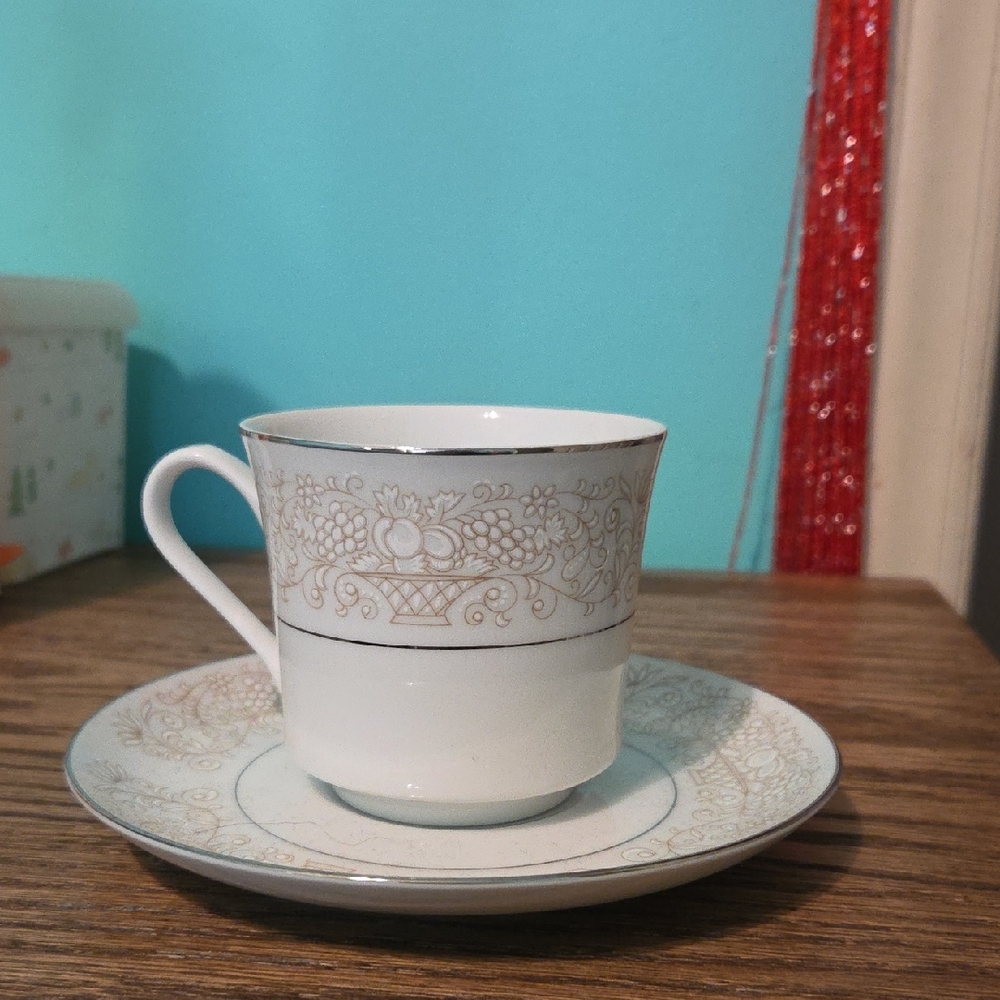 Elegant White and Gold Teacup and Saucer